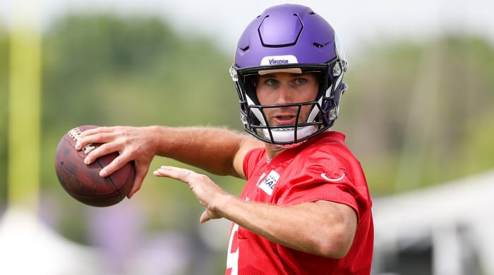 Vikings quarterback Kirk Cousins (8) throws at TCO Performance Center.